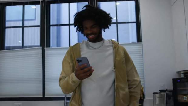 Shedeur Sanders talking to Jordan Seaton via facetime